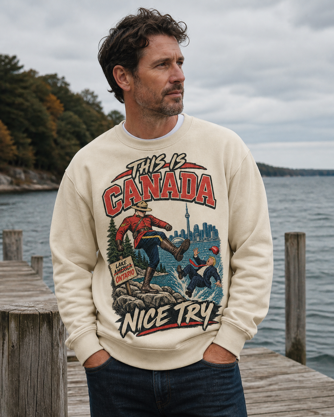 Cream | Model wearing the This is Canada crewneck beside Lake Ontario, front view.